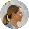 A circular profile picture of Emily White, a real estate agent, smiling professionally.